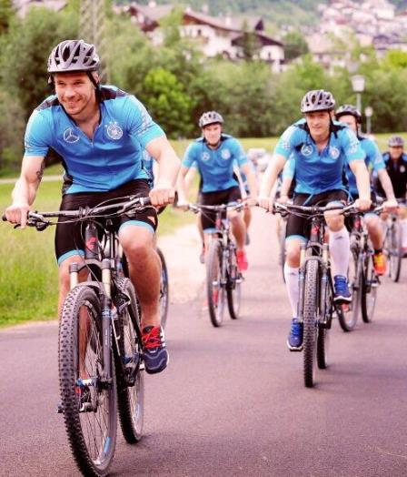 Podolski Ozil Cycling